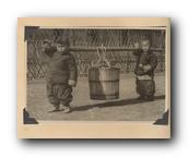 066 - Chinese Children carrying Honey Bucket.jpg